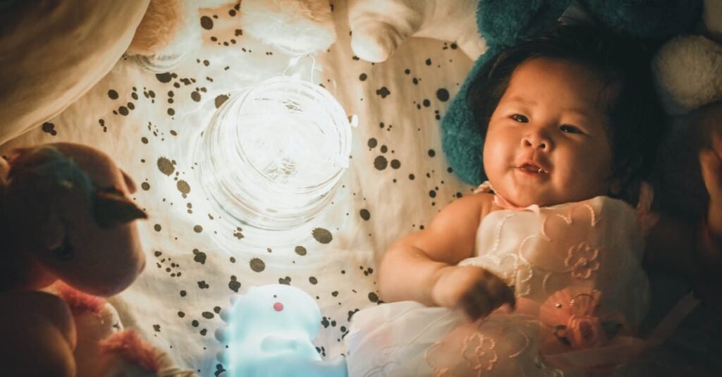 Adorable baby lying among toys in warm indoor lighting, creating a magical and playful atmosphere.